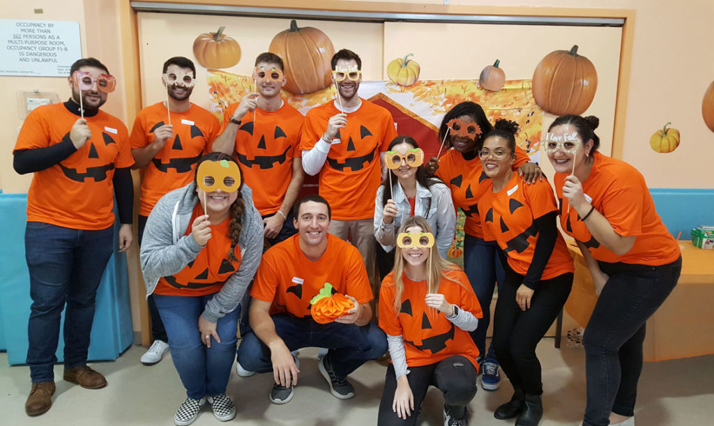 Mariner Wealth Advisors' associates volunteering at a Halloween Party